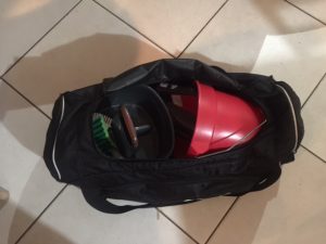 36 inch PUMA duffle bag half open showing cleaning supplies