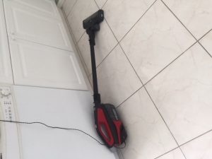 Dirt devil stick vacuum charging on wall outlet